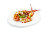 Deliciously cooked lobster with colorful garnishes on a white plate from Cinnamon Grand's YaluYalu Home Delivery service.