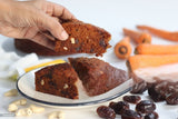 Sliced Signature Date Cake with nuts and dates on plate by YaluYalu