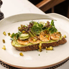 Sour Dough Toast with Grilled Marinated Prawns and Crushed Avocado by Hotel Cinnamon Grand - yaluyalu